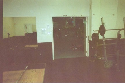 A darkened photograph of an exercise room.